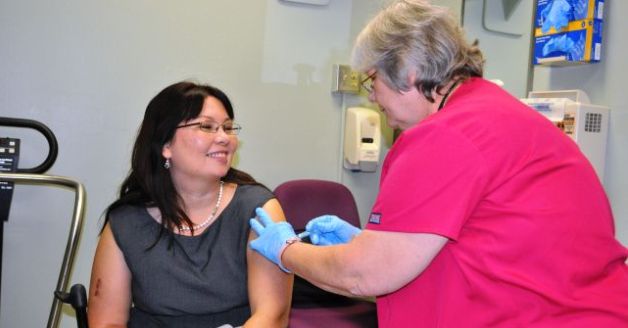 VA Assistant Secretary Tammy Duckworth receiving a flu shot