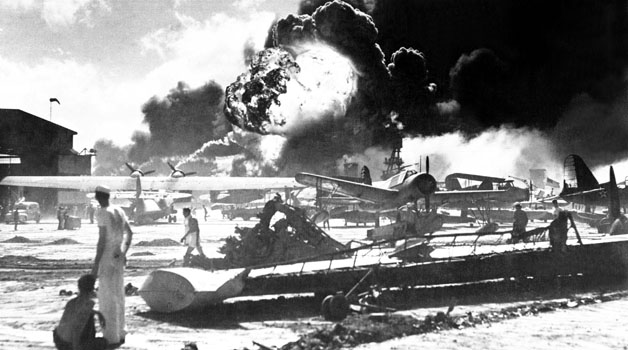 A fire rages during the attack on Pearl Harbor