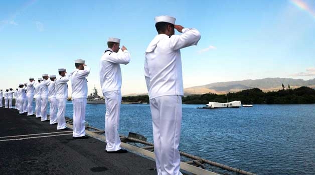 File photo of Sailors saluting the USS Arizona Memorial