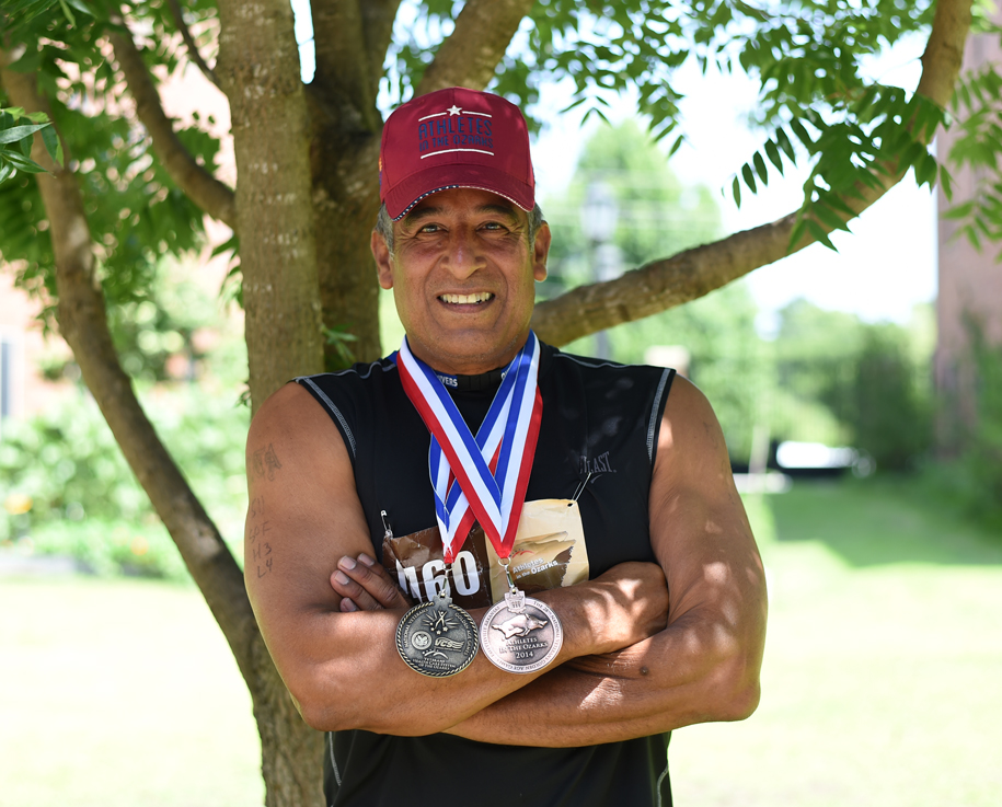John Martinez earned a medal with eight of ten events.