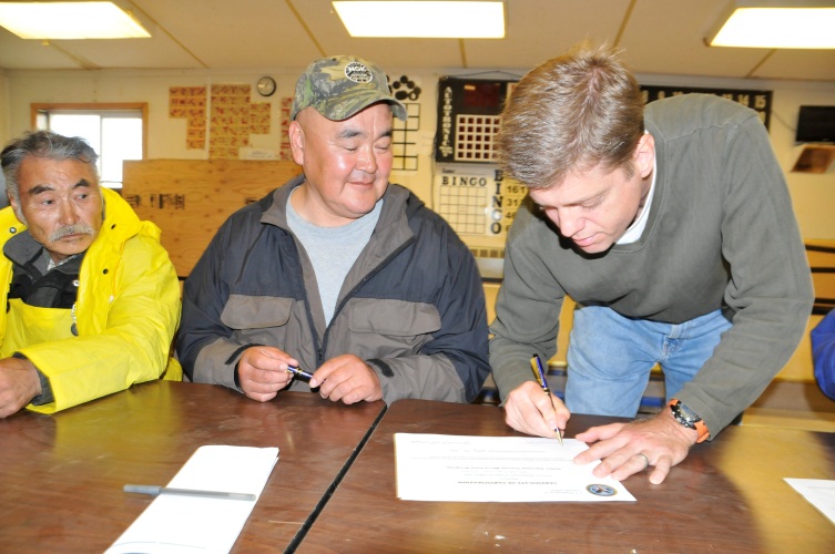 Mike Frueh and Joseph J. Lincoln, Jr., head of the Nunakauyak Tribe sign a letter of intent to work together to connect Alaska Veterans to VA’s home loan benefit.