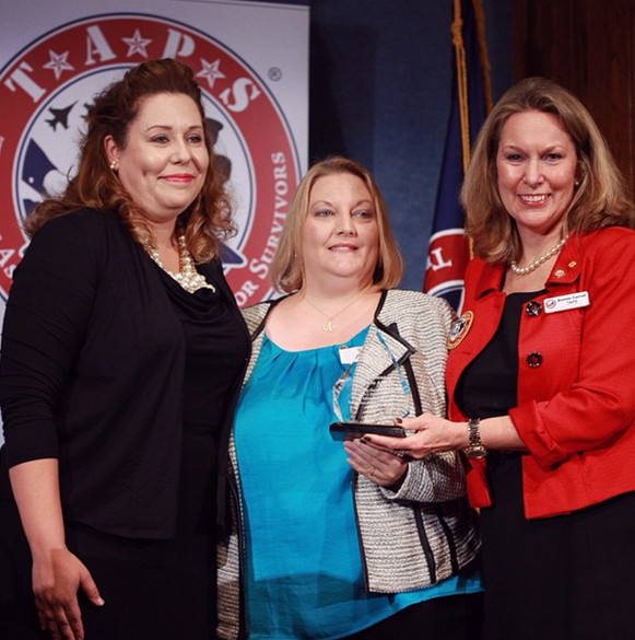 three women accepting an award