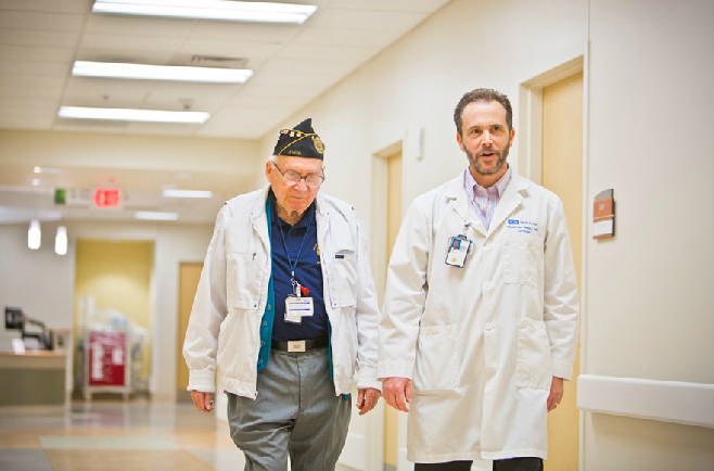 doctor walking with a veteran