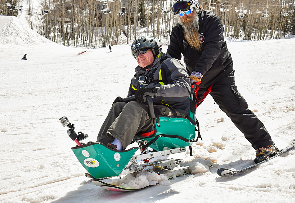 Veterans participating in downhill skiing.