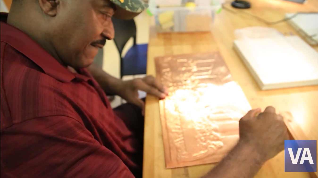 Veteran works on his copper matting project at the Tampa VA