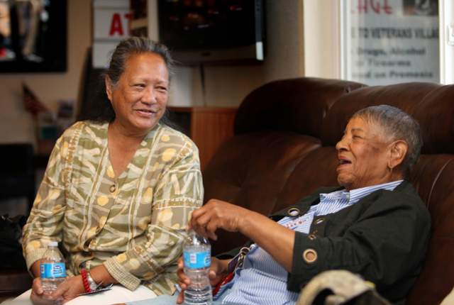 In the offices of Veterans Village, Cynthia Dias, left, who was a Navy corpsman in Vietnam, shares a laugh with 83-year-old Violet Young, who was in the Women‘s Army Corps during the Korean War. (File photo by Michael Quine/Las Vegas Review-Journal) 