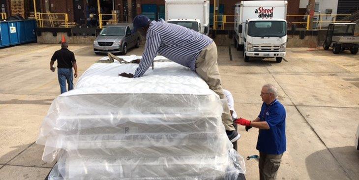 Image of men at Jennings Bryan Dorn VA Medical Center unloading mattresses