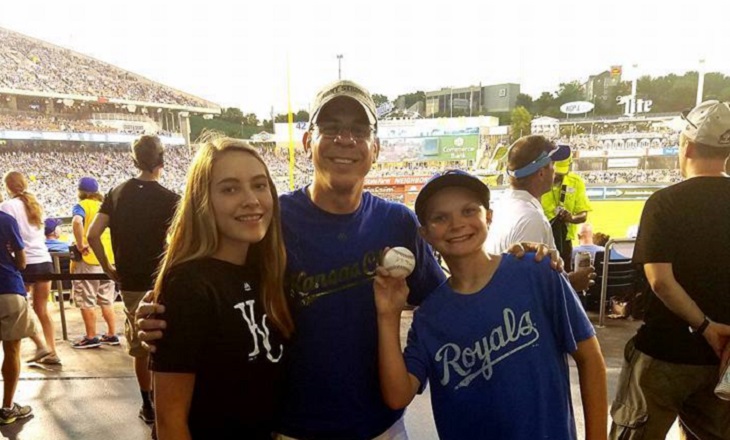 Image of an author and two children who gave him a baseball.