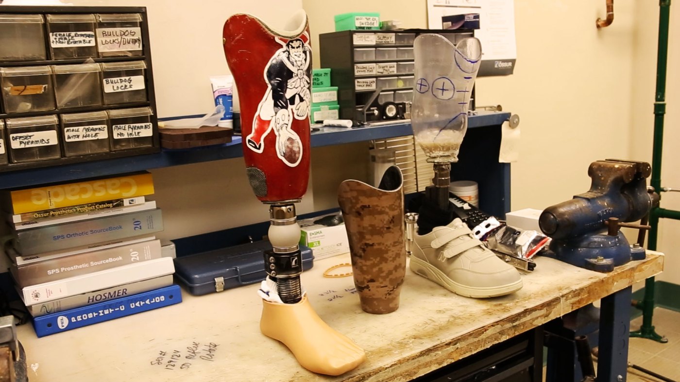Image of two prosthetic feet at a Prosthetics Lab