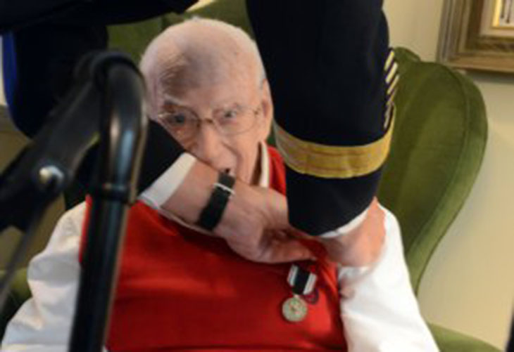 Dr. Charlie Stenger, a World War II Army veteran, is awarded the Prisoner of War Medal by Lt. Gen. James C. McConville, Army G-1, Aug. 16, 2016, at Stenger's home in Rockville, Maryland. (Photo Credit: David Vergun)