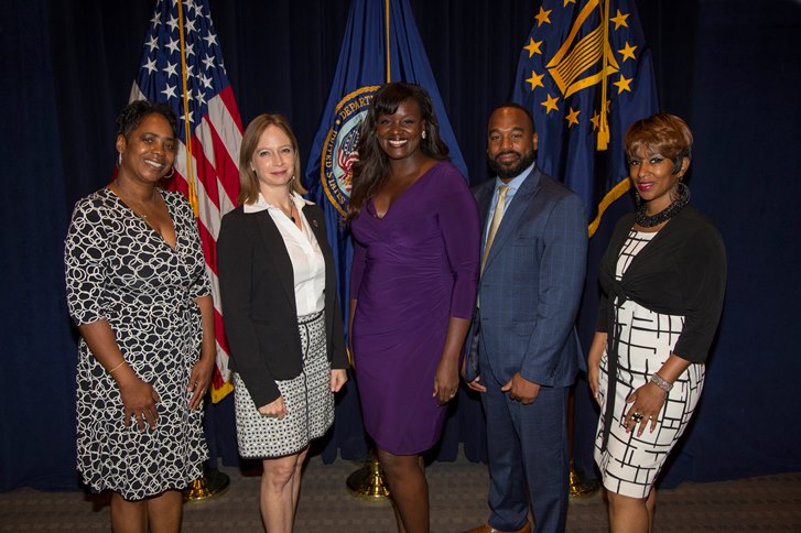 Image of Kayla Williams and four other celebrating Women’s Equality Day at VA's central Office.