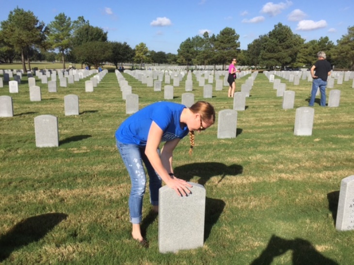 Volunteers clean headstones at VA national cemeteries