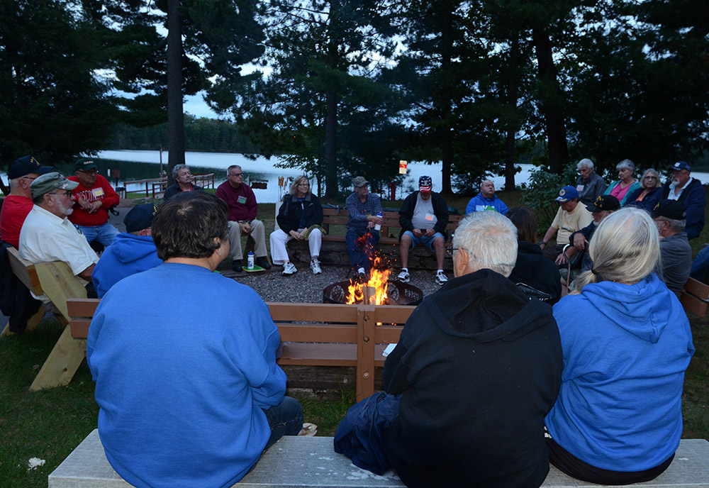 Veterans with diabetes sitting around camp fire