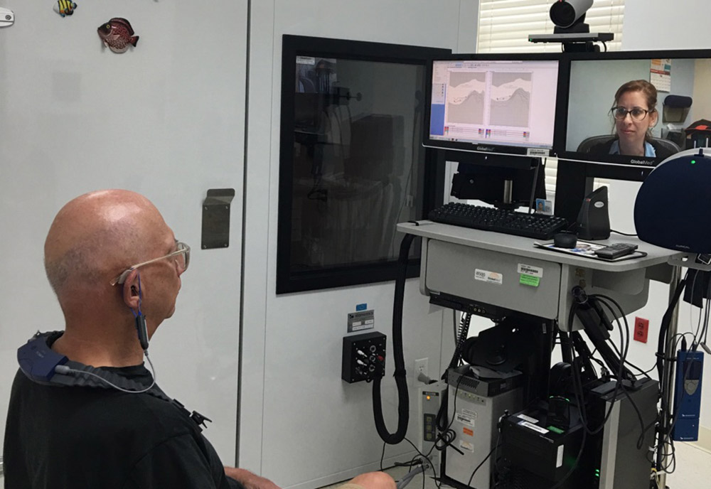 Army Veteran Jeffrey Weinstock meets with Dr. Erica Dombrowsky, audiologist, through Clinical Video Telehealth.