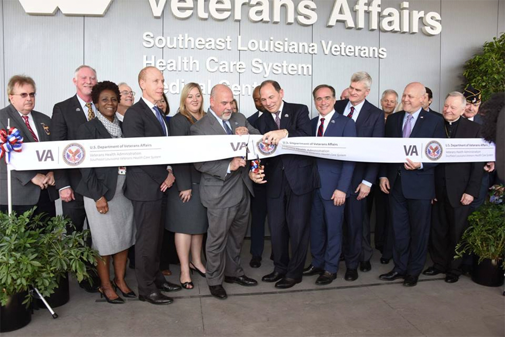 Officials gather to cut the symbolic ribbon at the New Orleans VA Hospital, celebrating the grand opening