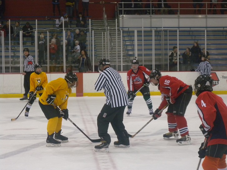 Image of blinded Veterans 'facing off' in a hocky match.
