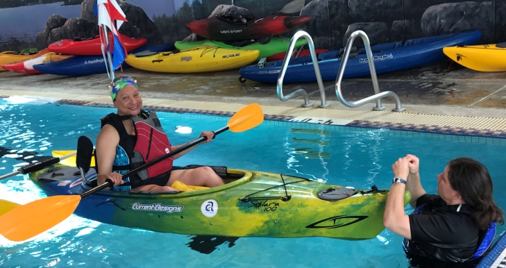 Image of Air Force Veteran Hope Cooper kayaking at the National Disabled Veterans Winter Sports Clinic.