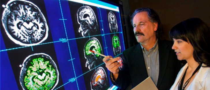 Image of VA researchers looking at brain scans