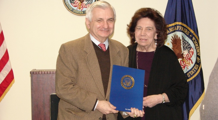 Image of Carla Murchelano being presented a certificate of appreciation