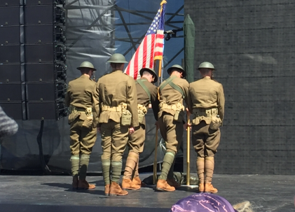 Soldiers from the 1st Infantry Division dressed as "Doughboys" present the colors at the World War I Commemoration Ceremony.