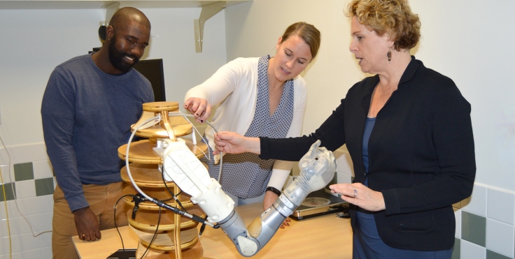 IMAGE: Dr Resnick (far right) discusses specific aspects of the t Life Under Kinetic Evolution Arm for Veterans with upper-limb amputation with VA Research Health Science Specialist Frantzy Acluche, and Project Coordinator Sarah Ekerholm.