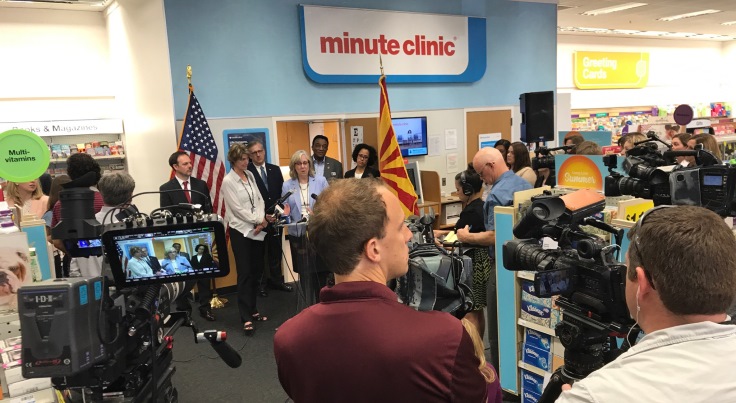 Image: News Media cameras capture the announcement at a local MinuteClinic.