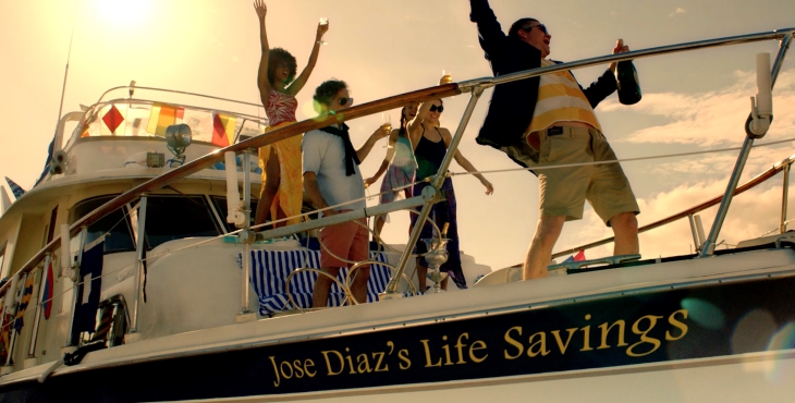 Image of people partying on a boat with the name "Jose Diaz's life savings' on the bow.