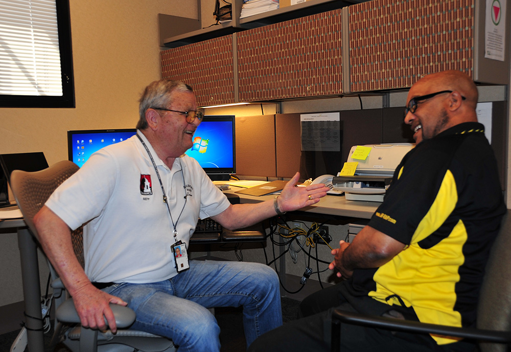 Peer Support Specialist DeWayne Raulerson shares a laugh with Army Veteran Vernon Williams at the Tucson VA. Photo by Clifford Baser