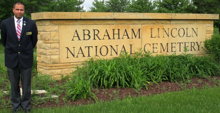 IMAGE: Christopher Hill Sr. standing next to the Abraham Lincoln National Cemetery entrance.