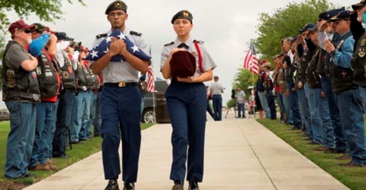 IMAGE: Cadets from the Douglas MacArthur High School JROTC receive the cremains of the five Veterans from the Patriot Guard Riders and escort them to the viewing area.