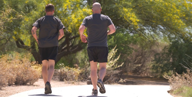 Image of two men in PT gear running on a trail