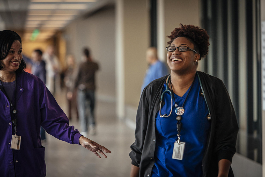 A VA Nurse and Physician share a laugh.