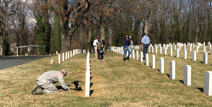 Image: military members shooting video at a VA national cemetery