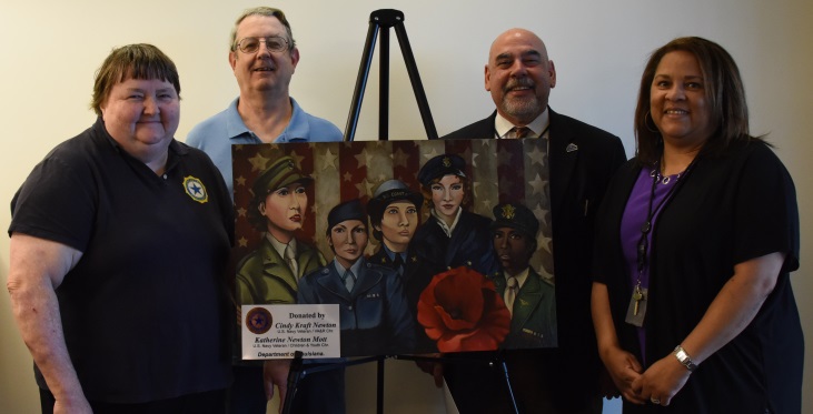 Image: Veterans Cindy and Bryon Newton (far left) donated an original Heather Englehart painting to be displayed inside the new Women’s Health clinic on the seventh floor of the new Veterans medical center. SLVHCS medical center director Fernando O. Rivera (right) accepted the painting, along with Health Promotion and Disease Prevention manager Gweneh Vilo (far right).
