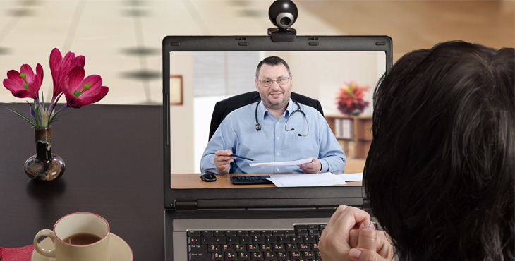 Image: A doctor consults with a patient via video.