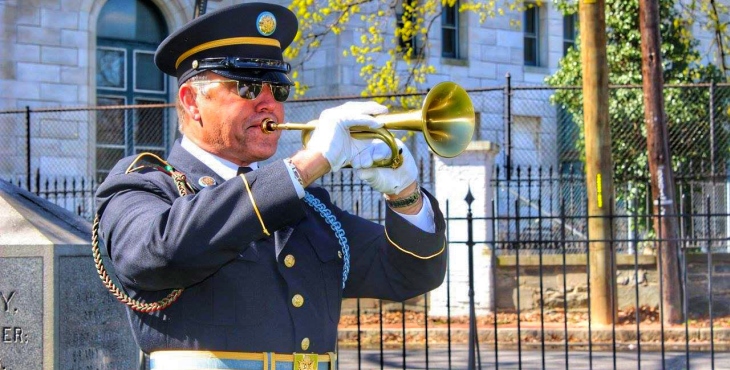 VA employee volunteers time to play Taps at military funerals