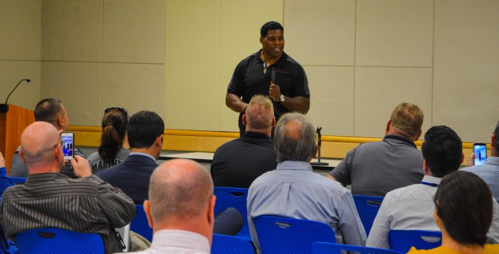 IMAGE: Football legend Herschel Walker shared his battle with dissociative identity disorder with a packed room of Veterans and VA employees, Oct. 3, at the Carl T. Hayden Medical Center.