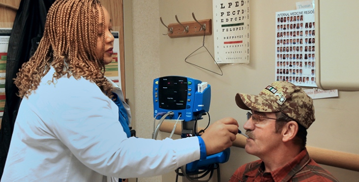 IMAGE: . VA North Texas patient, Brett Baker, gets his vitals taken by a Bravo Clinic Licensed Vocational Nurse