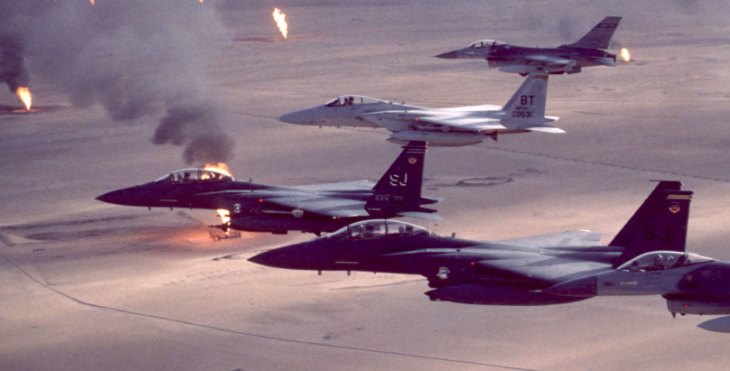Image: US aircraft fling over burning oil well during the first Gulf War.