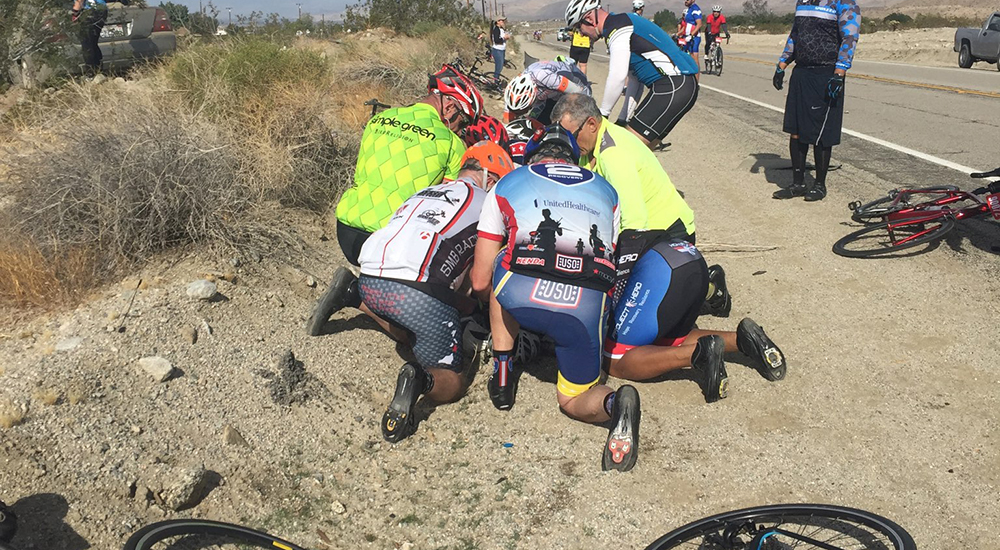 A driver estimated to be traveling at 85 mph lost control of his vehicle and collided with two cyclists. The group immediately rendered aid to the more seriously injured cyclist.