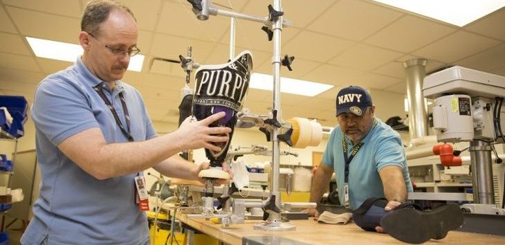 Prosthetic and Sensory Aids Service team members Claude St. Pierre and Juan Montelongo for work inside the prosthetic lab located inside the VA Health Care Center at Harlingen, Jan. 24, 2018. (U.S. Department of Veterans Affairs photo/Luis H. Loza Gutierrez)