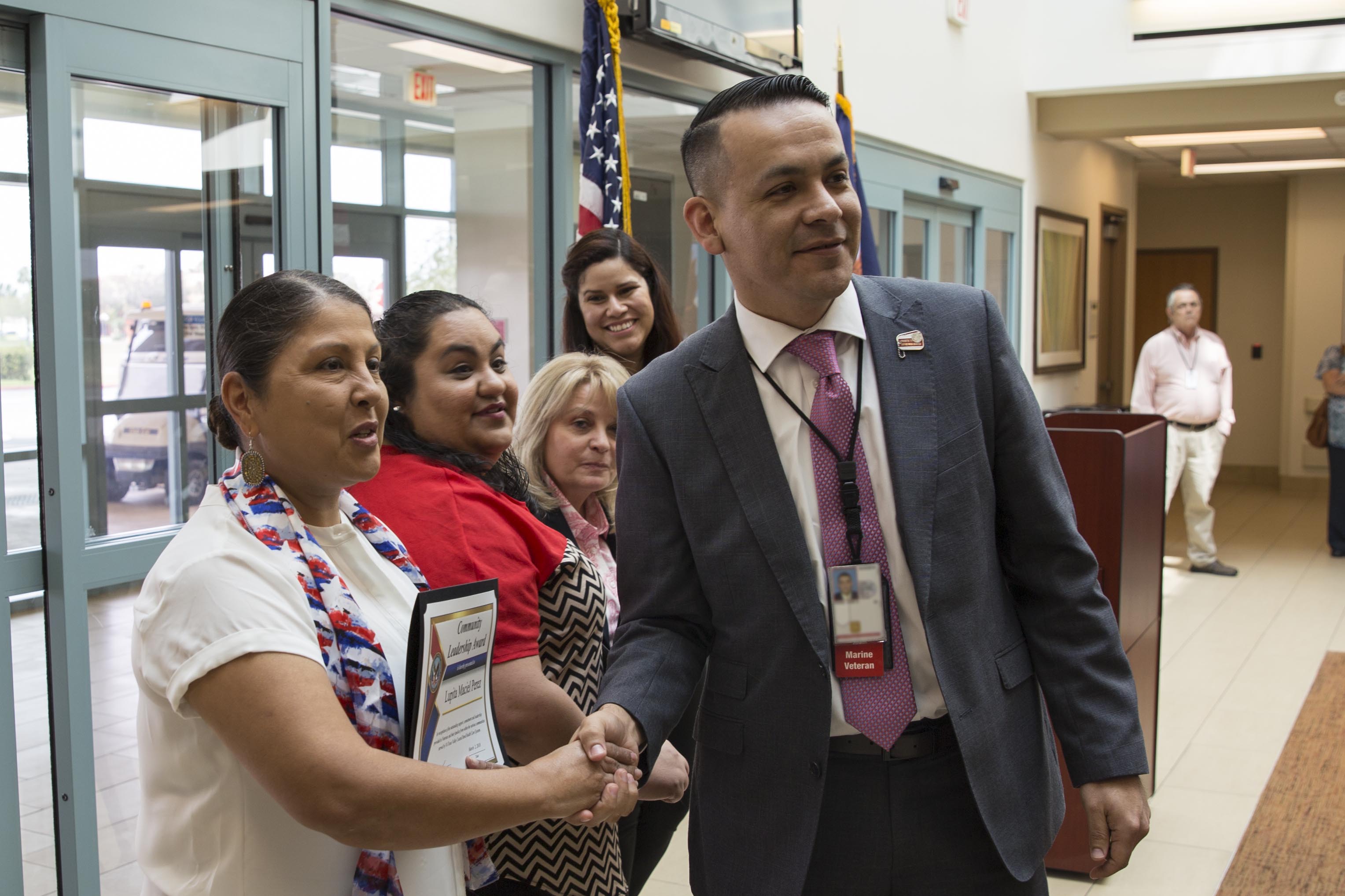 Mr. Joe A. Perez the director of VA Texas Valley Coastal Bend Health Care System gives Ms. Lupita Maciel Perez a congratulatory handshake during the health care system's ceremony held in observance of this year’s Women History Month, which took place March 2, 2018, at the VA Health Care Center at Harlingen, Texas. Ms. Maciel Perez is the junior vice commander for District 18 for the Veterans of Foreign and a national legislative committee Member for the VFW. She was one of nine Women Veterans from local communities to receive a VA Community Leadership Award for their advocacy and work in benefit of Veterans and their families. (U.S. Department of Veterans Affairs photo/Luis H. Loza Gutierrez)
