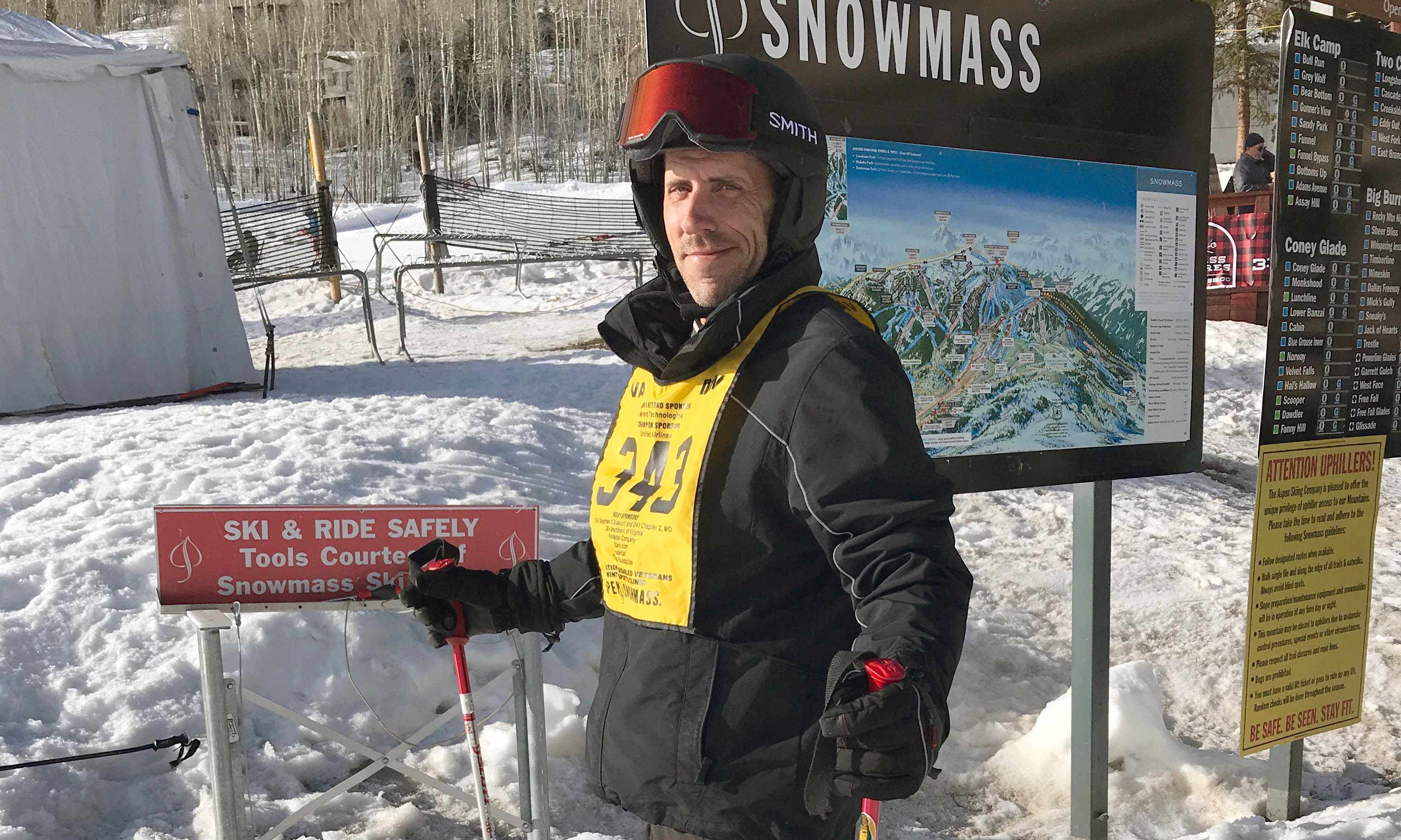 veteran standing in skis and helmet