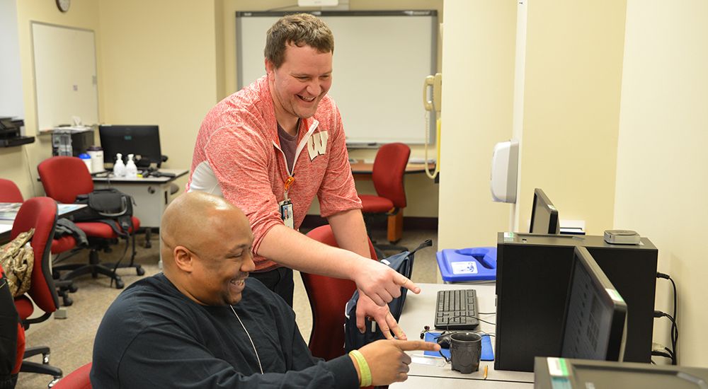 Navy Veteran Maurice Williams and Lee Pingel, Community Employment Coordinator, enjoying interacting during a SAW training session. Photos by Mark Cristler, Visual Information Specialist