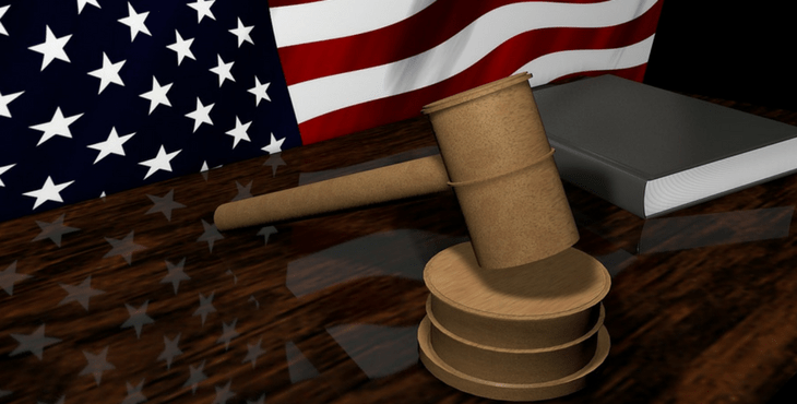 IMAGE: A US Flag and a gavel on a bench