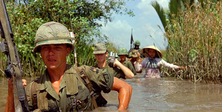 IMAGE: Pvt. Fred L. Greenleaf crosses a deep irrigation canal during an allied operation during the Vietnam War. (Photo: National Archives)