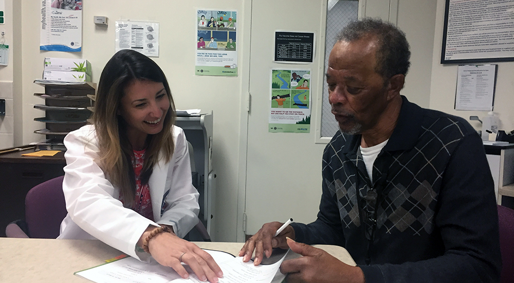 Dr. Candis Cornell discusses tobacco cessation strategies with Air Force Veteran Johnie Chattman in preparation for their next tobacco cessation session. (Photo by Melanie Thomas).