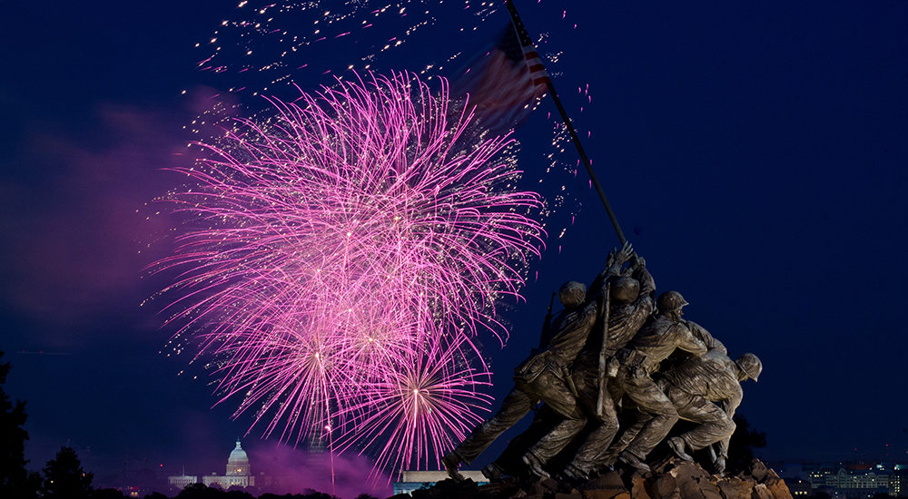 Fireworks are seen from the U.S. Marine Corps Memorial area, in Arlington, Va. on July 4, 2013. To the left of it, in the distance, is a corner of the Lincoln Memorial, then the U.S.. Department of Agriculture Yates Building (dark red brick building), the