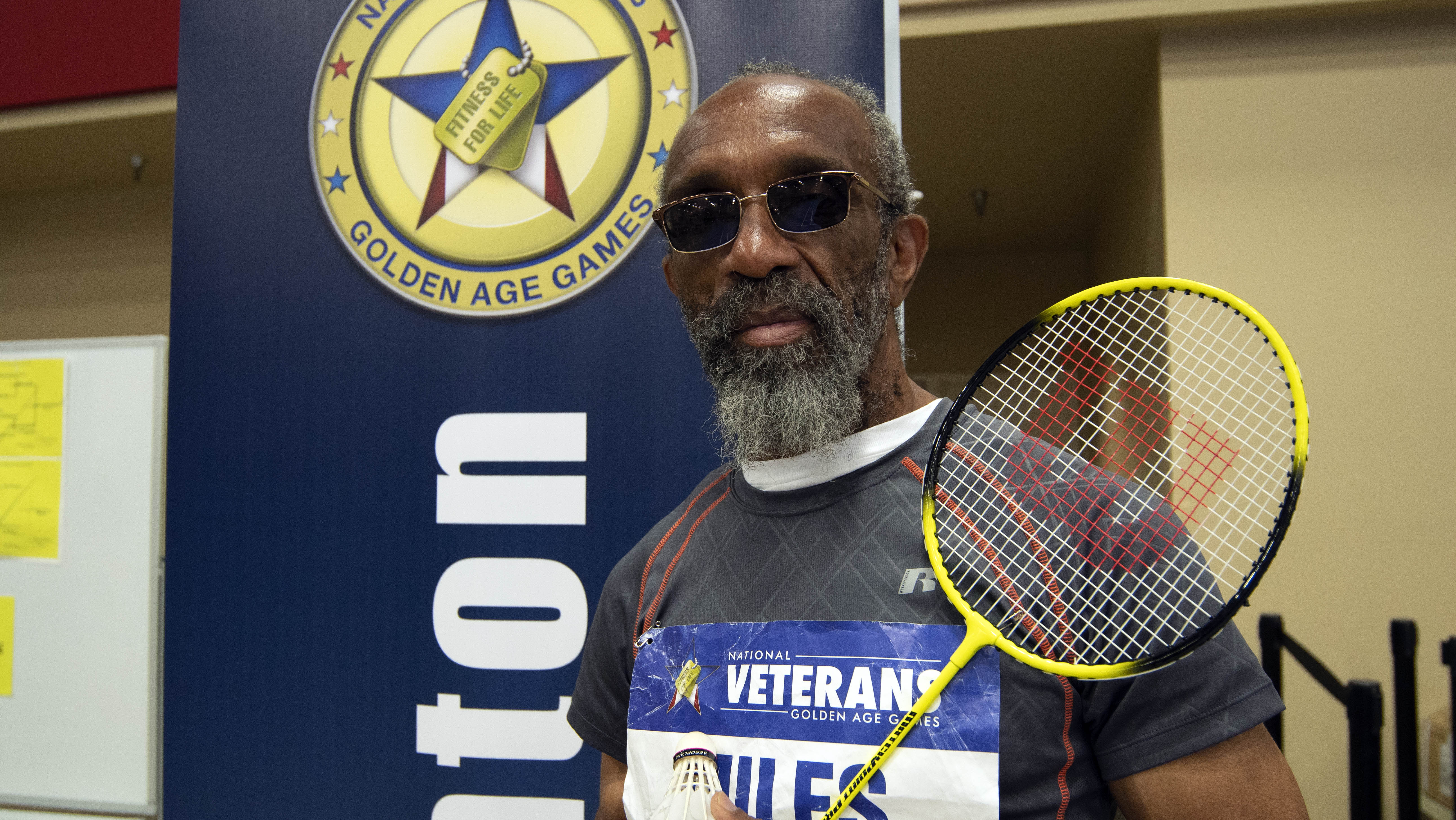 Veteran with badminton racquet