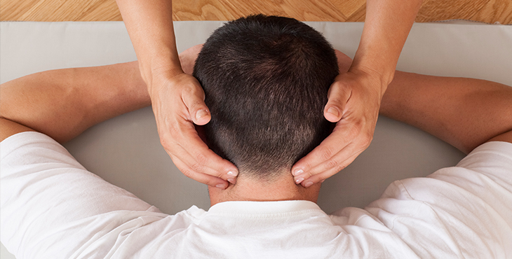 man receiving neck massage